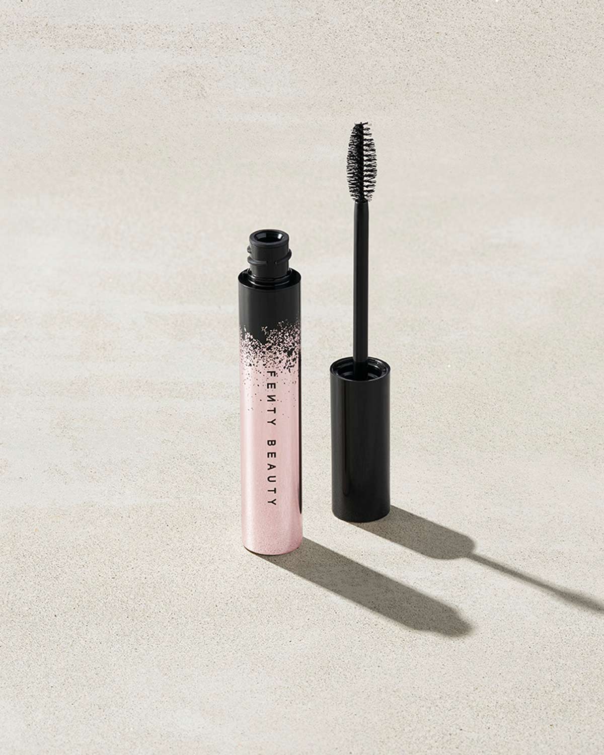 Full Frontal Volume, Lift & Curl Mascara featuring the exclusive flat-to-fat wand and brush.