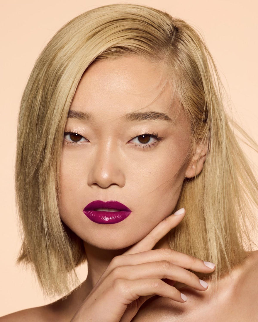 light skin tone model wearing poutsicle hydrating lip stain in shade gem and i